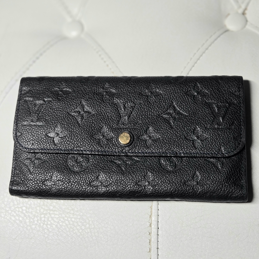 Blk Louis Vuitton Virtuose wallet, Monogram Empreinte leather Very Good. COA